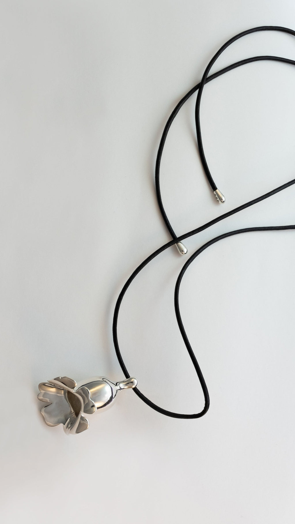 flower necklace in silver on a white background