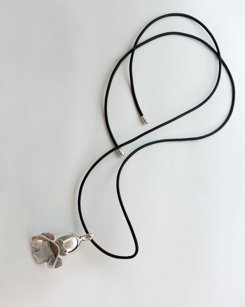 Necklace with a floral pendant on a white background