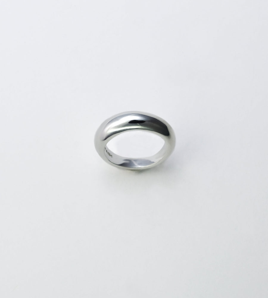 Silver ring on a light gray background