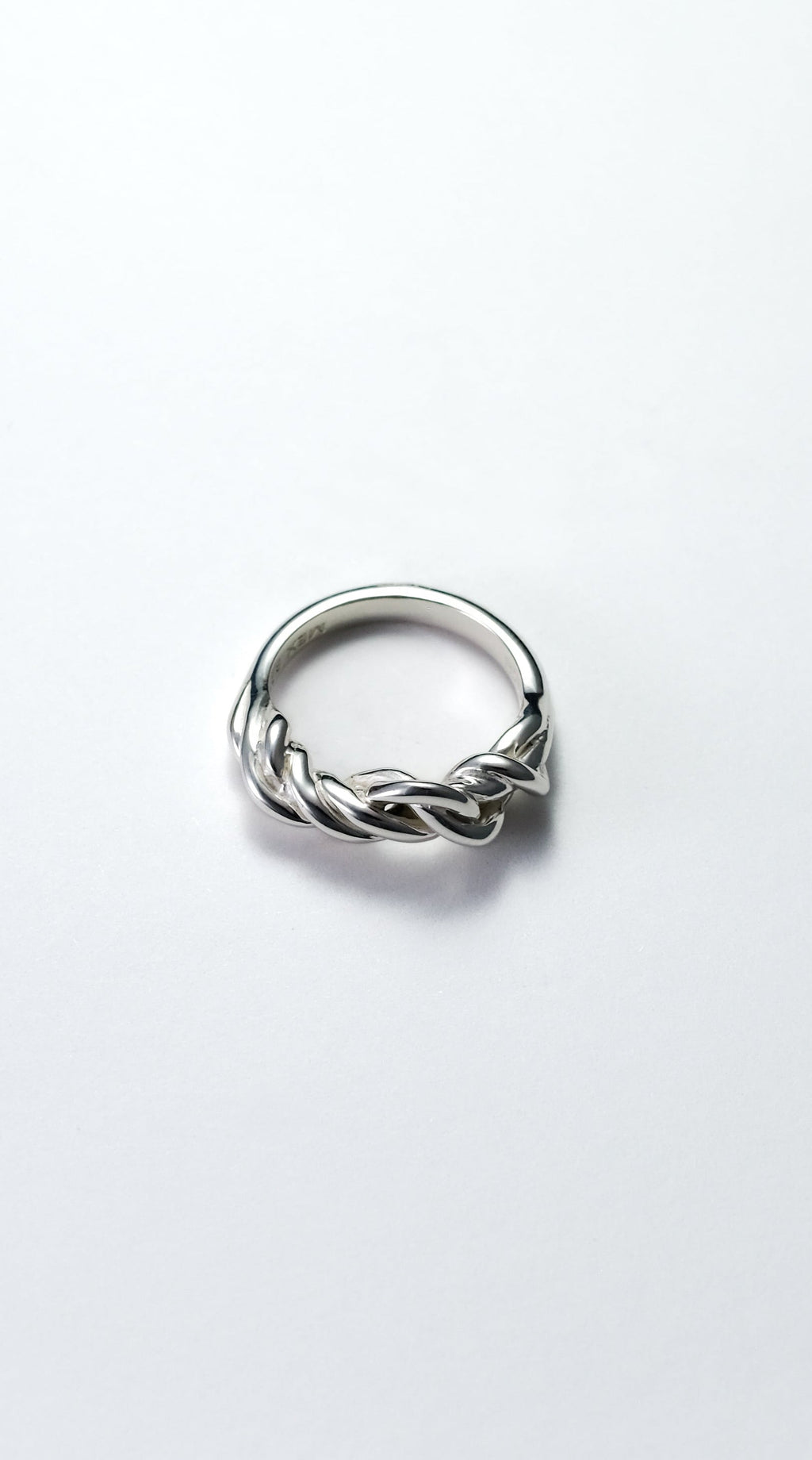 Silver ring on a white background