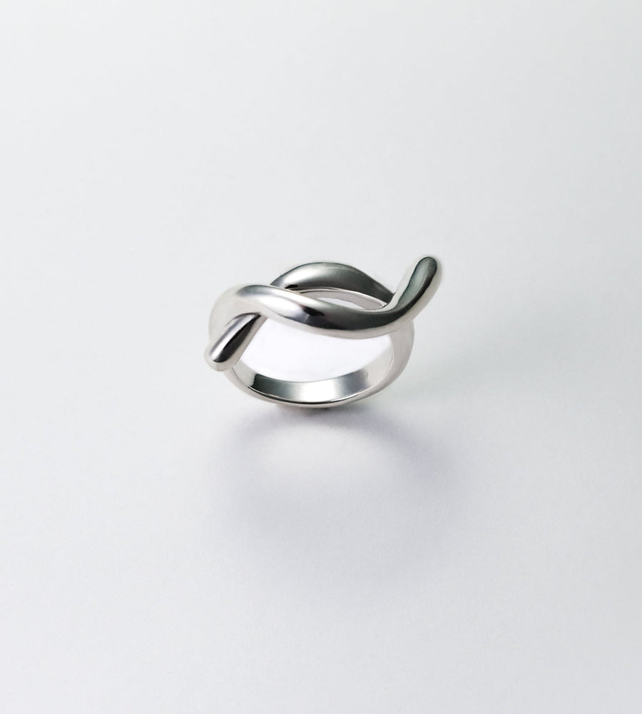 silver ring on a light gray background 