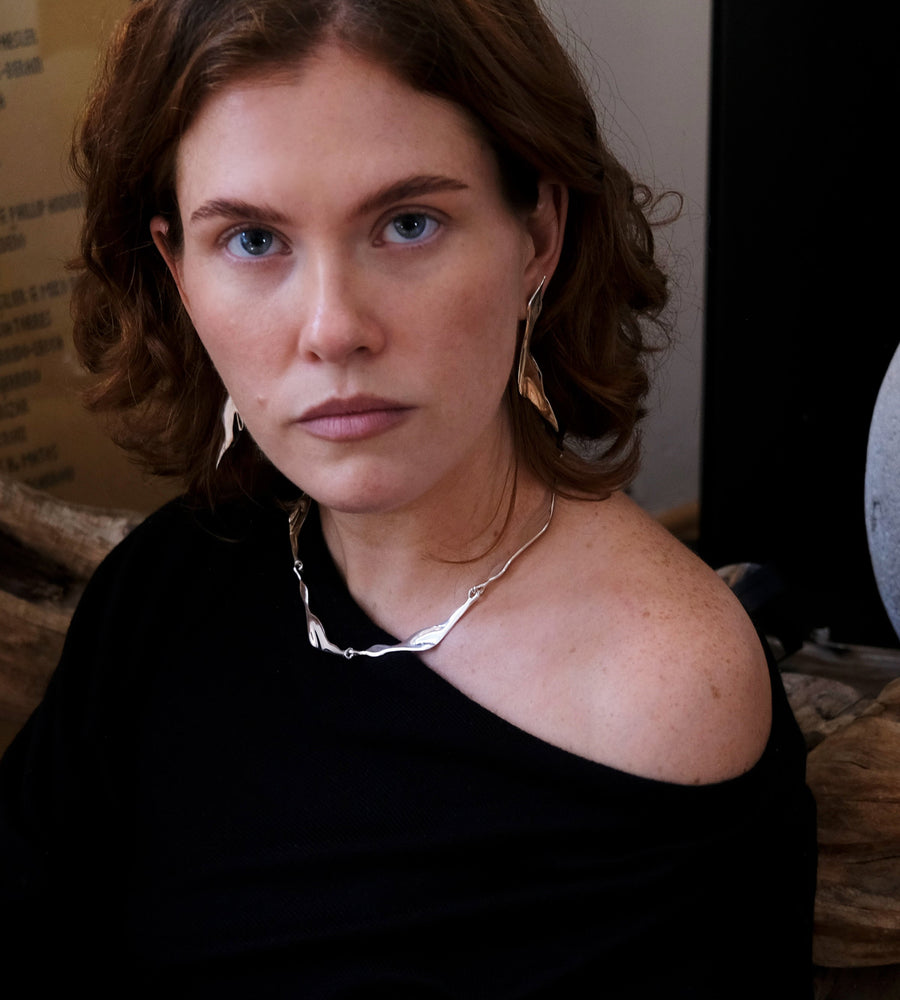 woman wearing garzas silver set by virginia Jirash
