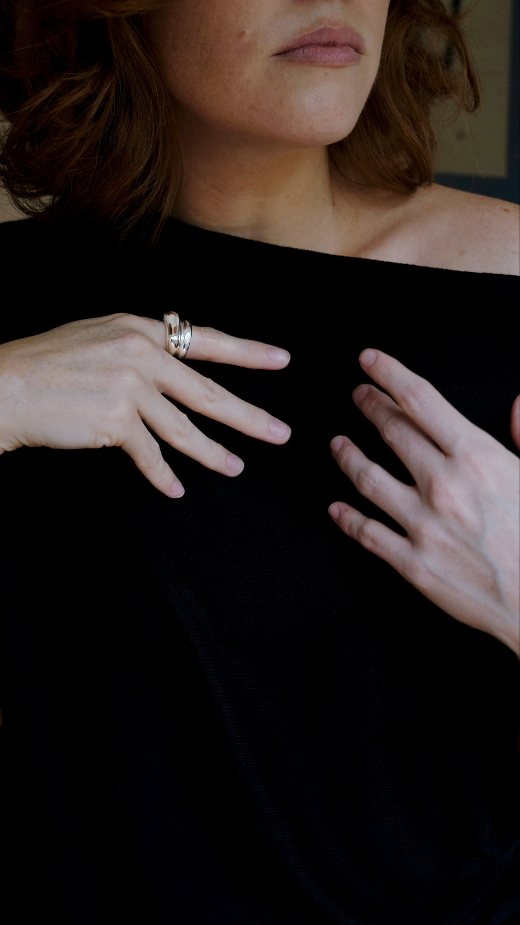 woman wearing sterling silver ring stacks